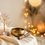 Brass diya crystal tree and singing bowl on cream silk - GemsMantra pooja and spiritual decor collection banner