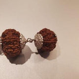 Customer photo: two capped Rudraksha beads