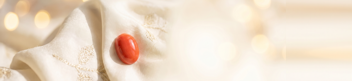 Red Coral Moonga stone on cream silk — collection hero