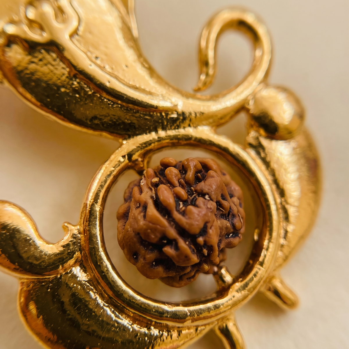 Close-up of the natural Rudraksha bead set in the Siddhi Ganesha pendant